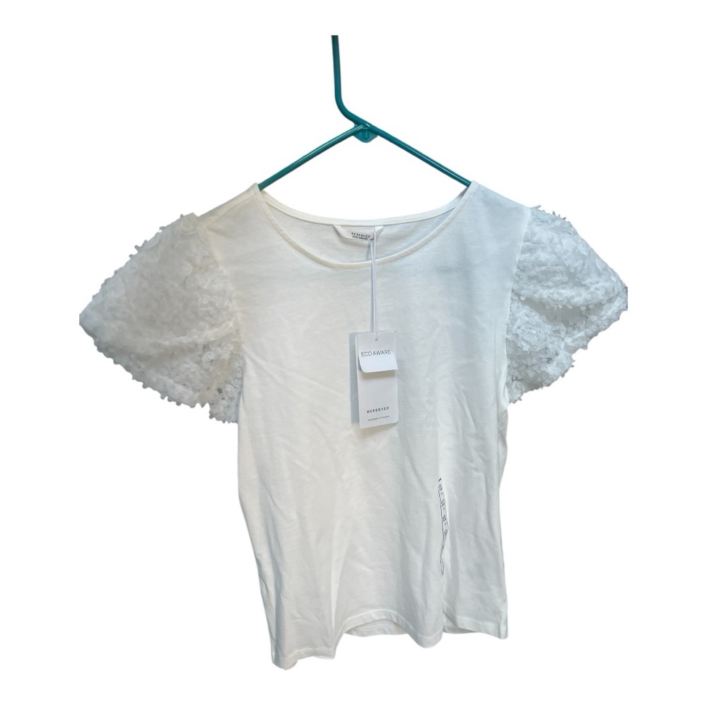 Reserved White Blouse with Elegant Design